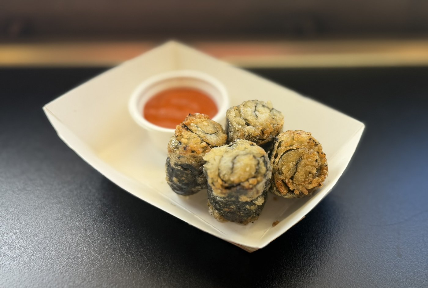 Crispy fried kimbap bites with dipping sauce